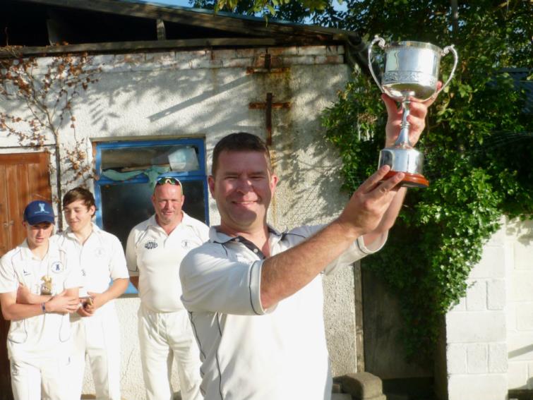 Delighted Haverfordwest 3rds skipper Matthew Vaughan raises the Ken  Morris Cup aloft